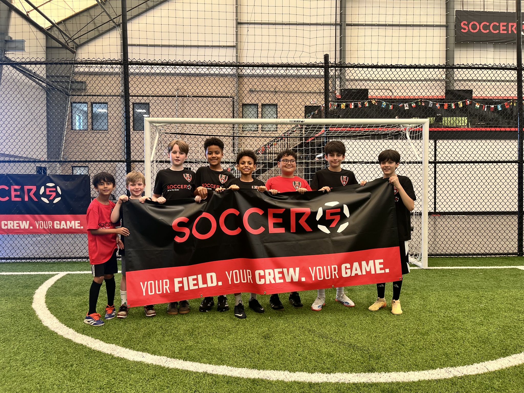 Children gather at Soccer 5 for fun soccer camp activities